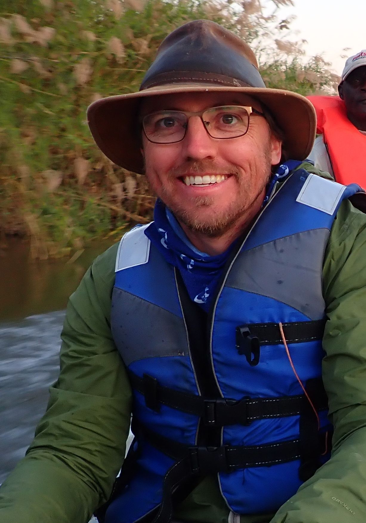 Dr Matthew Burnett in a life jacket on the water